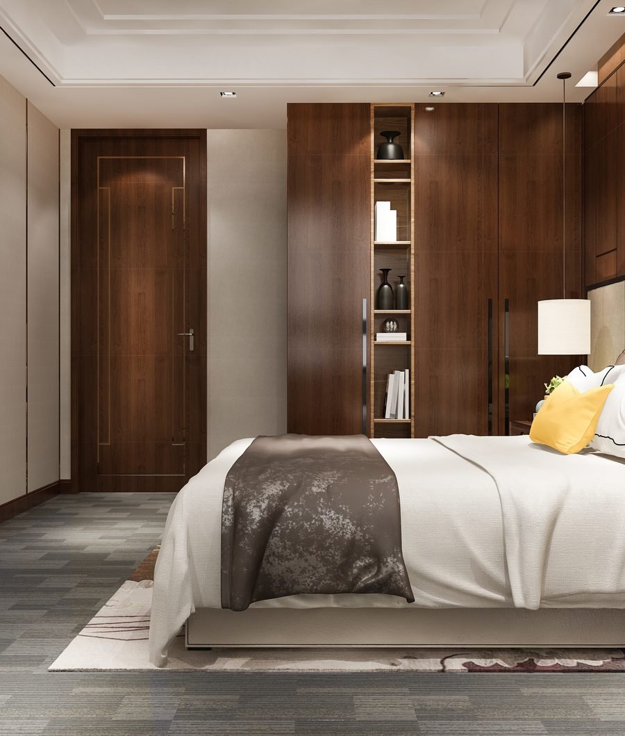 Bedroom project with a full-height walnut wardrobe wall