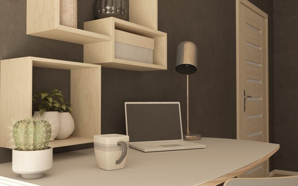 Styled home office corner with floating wooden shelves
